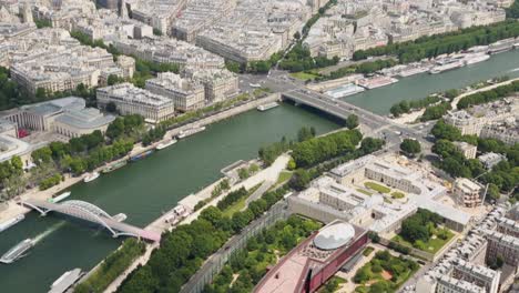 Handheld-camera-view-of-the-Seine-River-from-the-top-of-the-Eiffel-Tower-north-wing,-Paris,-France