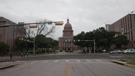 Texas-state-capitol-in-Austin,-Texas-with-gimbal-video-walking-along-the-street