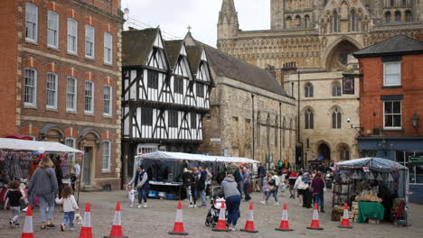 Lincoln-market-town-tudor-buildings-and-Mary-Magdalene-church-with-tourists-and-people-shopping