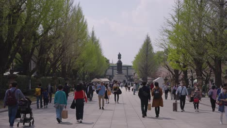 Yasukuni-Shrine-Walkway-in-Spring,-Japanese-People-Visiting-Historic-Temple