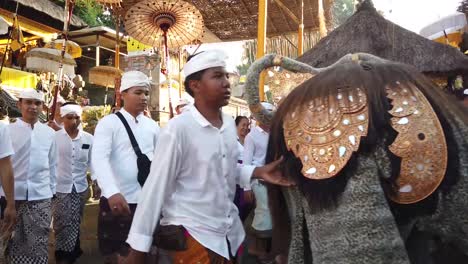 Barong-Mystical-Creature-Walks-in-Procession-at-Balinese-Hindu-Temple-Ceremony,-Indonesia,-Crowded-Outdoors-Religious-Event