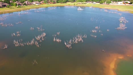 Aerial-footage-of-a-pond-in-Woodland-Park-in-Krugerville-Texas