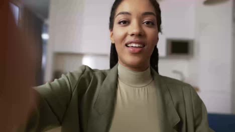 Screen-headshot-of-smiling-African-American-woman-wave-greet-talk-speak-on-video-call