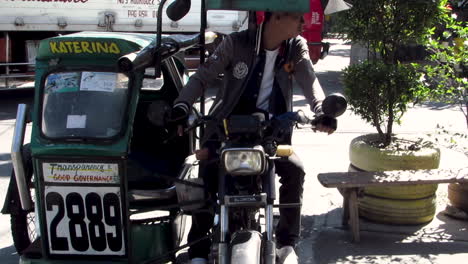 Tricycle-Driver-is-Waiting-on-a-Passenger,-Philippines