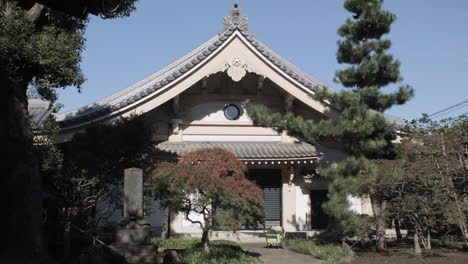 Establishing-Shot-of-an-Ornate-Tokyo-Temple-with-Pretty-Trees-Blowing-Slightly-in-the-Breeze