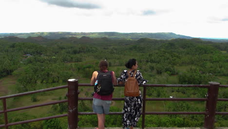A-Couple-Admiring-The-View-of-the-Chocolates-Hills-of-Bohol,-Philippines