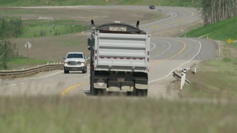 Dump-truck-drives-by-on-highway-near-Dunvegan-Alberta