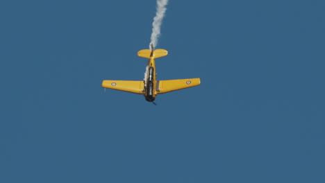Stunning-shot-of-Close-up-of-North-American-Harvard-Mark-IV-airplane-in-vertical-dive-at-airshow-in-slow-motion