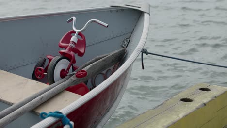 Red-Radio-Flyer-tricycle-in-a-fishing-boat