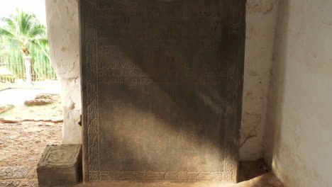 Revealing-shot-of-solitary-tombstone-nestled-within-Saint-Paul-Church,Malacca