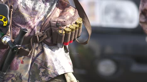Closeup-of-ammo-belt-worn-by-hunter-loaded-with-12-gauge-shotgun-shells