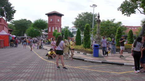 Tourists-from-diverse-backgrounds-clicking-photos-on-mobile,Malacca