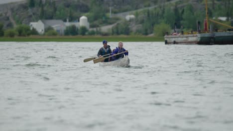 Family-in-canoe-paddling-in-choppy-water