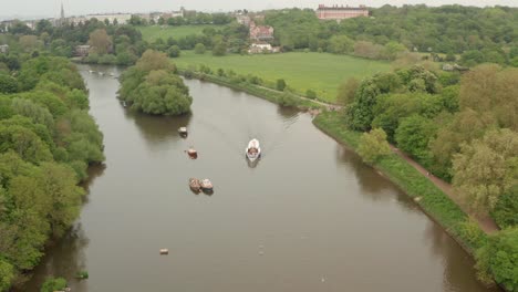 Pan-down-aerial-shot-over-paddle-ship-on-the-Thames