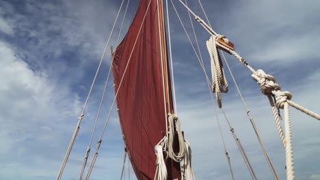 General-view-of-Mast,-sales,-ropes-and-Backstay-of-Polynesian-double-hulled-voyaging-canoe---Tilt-down-wide-shot