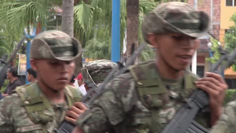 Army-Soldiers-Marching-Past-In-Formation-On-Street-In-Peru