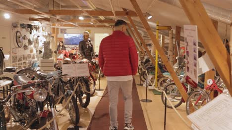 Man-Visiting-Motola-Motor-Museum-In-Motala-Harbour,-Sweden
