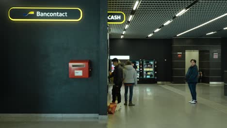 People-Withdrawing-Money-At-The-Cash-Point-Station-In-Namen,-Belgium