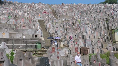 People-walk-down-the-steps-at-the-Diamond-Hill-cemetery-during-the-annual-Chung-Yeung-Festival-as-citizens-visit-family-members'-graves-and-bring-offerings-in-remembrance-and-respect