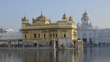 Hundreds-of-people-visiting-the-Golden-Temple,-Sikh-Gurdwara,-Amritsar-Punjab-India