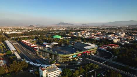 Aerial-view-around-the-Foro-Sol-Venue-and-the-Autódromo-Hermanos-Rodríguez,-sunset-in-Mexico-city