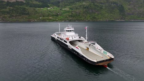 Ferry-Gloppefjord-from-Fjord-1-company-in-Norway---Beautiful-aerial-flying-around-ship-while-it-is-underway-crossing-the-sea-between-Anda-and-Lote