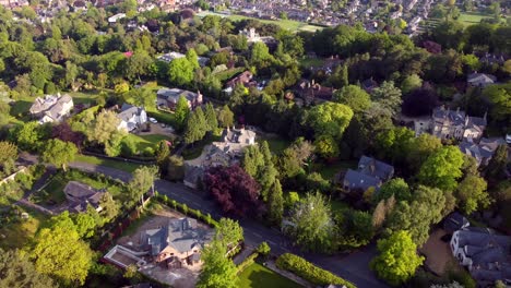 Drone-flight-over-luxury-houses-located-in-Alderley-edge,-Cheshire,-UK,-Europe