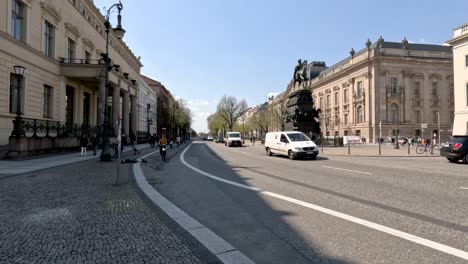 Cycle-Path-With-Cyclists-Going-Past-Equestrian-statue-of-Frederick-the-Great-In-Berlin