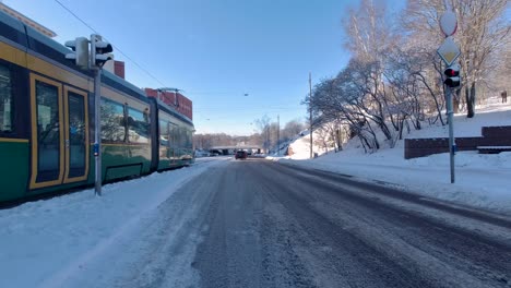 The-tram-navigates-snowy-city-streets,-overcoming-challenges-with-grace