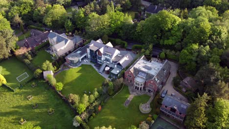 Drone-flight-over-luxury-houses-located-in-Alderley-edge,-Cheshire,-UK,-Europe