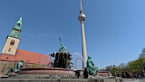 Low-angle-shot-of-neptune-fountain-and-Berliner-Fernsehturmin-in-Berlin