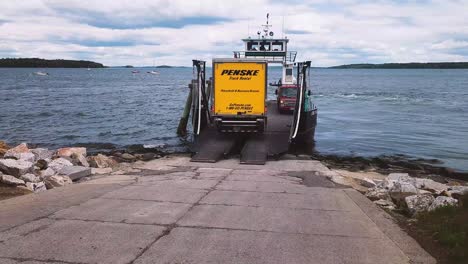 Big-yellow-truck-drives-onto-island-ferry-at-East-End-Beach