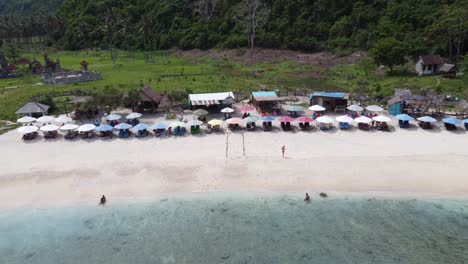 Aerial,-People-relaxing-on-Atuh-Beach-in-Nusa-Penida-Island,-Bali-indonesia