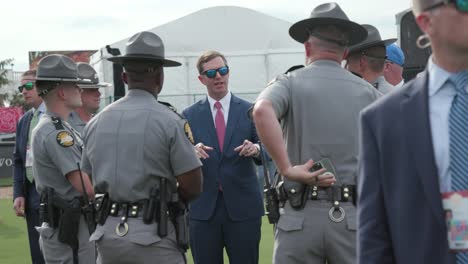 Kentucky-Governor-Andy-Beshear-in-paddock-with-State-police-before-Kentucky-derby