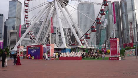 Hong-Kong-Observation-Wheel,-the-iconic-Central-Harbourfront-in-Hong-Kong,-with-AIA-company-logo