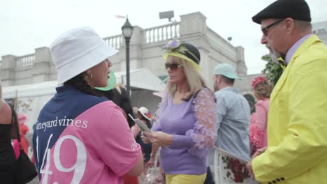 Woman-handing-out-programs-at-Kentucky-derby-149