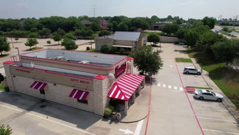 Aerial-footage-of-Freddys-Frozen-Custard-and-Steakburgers-Highland-Village-Texas-located-at-3040-Justin-Rd,-Highland-Village,-TX-75077