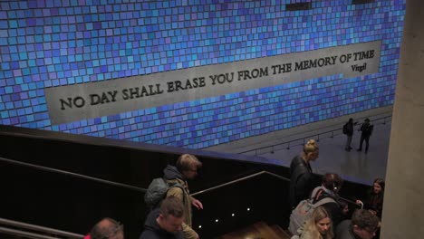 Interior-of-National-September-11-Memorial-and-Museum-with-Virgil-inscription-on-blue-wall,-New-York