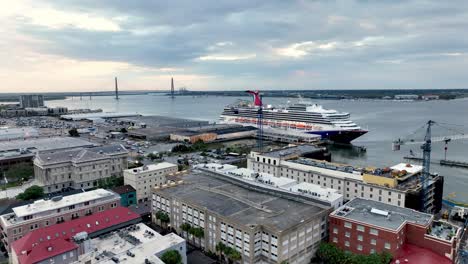 Aerial-push-in-to-carnival-cruise-line-ship-at-port-in-historic-charleston-sc,-south-carolina
