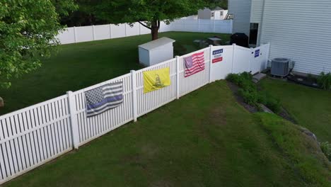 Fence-with-conservative-and-republican-themed-flags