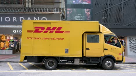 German-express-delivery-shipping-mail-company-DHL-truck-seen-stationed-on-the-street-of-Hong-Kong