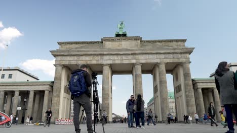 Male-Photographer-Standing-Beside-Tripod-Preparing-To-Get-Photo-Of-The-Brandenburg-Gate