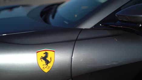 Close-up-shot-of-a-Black-Ferrari-parking