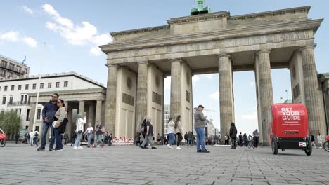 Low-Angle-Shot-From-18-of-March-Square-Beside-Brandenburg-Gate-With-Tourists-And-Cyclists-Going-Past