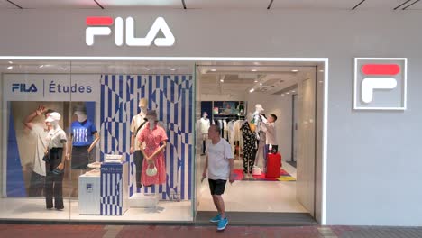 A-shopper-is-seen-leaving-the-Italian-sportswear-goods-brand-Fila-store