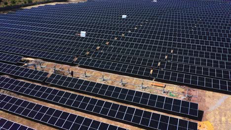 A-lot-of-laborers-are-lifting-up-the-solar-modules-and-taking-them-to-the-fitting-which-will-work-to-generate-the-solar-farm-electricity