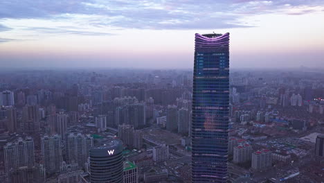 Aerial-Shot-of-W-Hotel-and-Sinar-Mas-Center-with-Shanghai-Skyline-in-Background