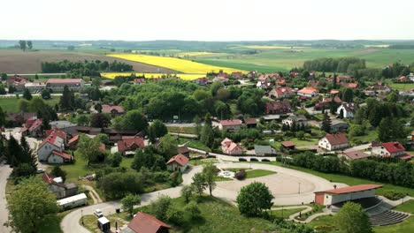 Gietrzwałd-village,-drone-flight-over-the-village-buildings
