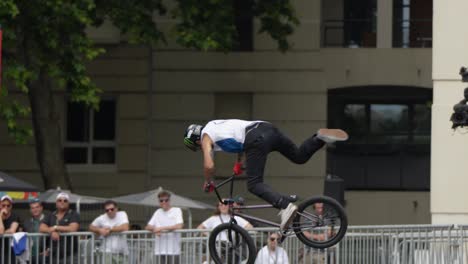 BMX-biker-performing-advanced-tailwhips-in-mid-air-at-FISE,slow-motion