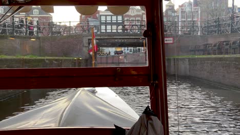 Private-canal-cruise-with-locals'-boat-in-Amsterdam
